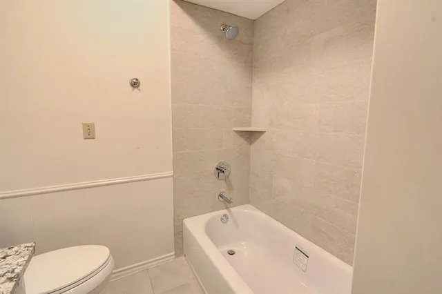 a bathroom with a toilet and a sink