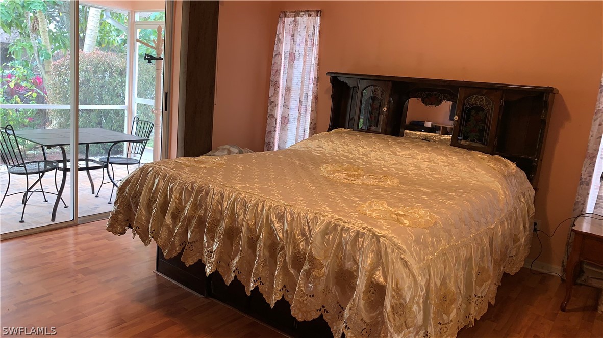 9116 Irving Road Fort Myers, FL 33967 - Photo 4 of 21 a bed sitting in a bedroom next to a window