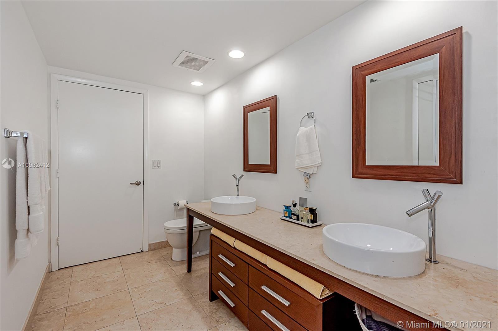 475 Brickell Avenue, Unit 4812 Miami, FL 33131 - Photo 14 of 26 a bathroom with a sink double vanity and a mirror