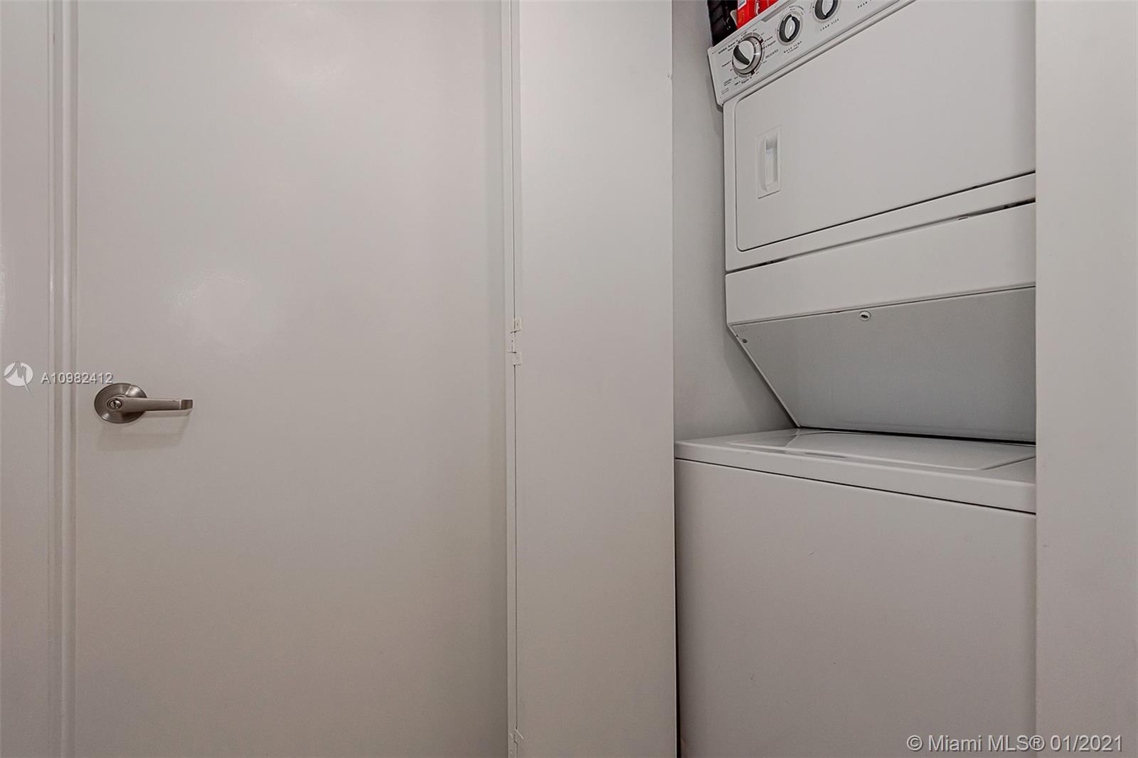 475 Brickell Avenue, Unit 4812 Miami, FL 33131 - Photo 17 of 26 a utility room with dryer and washer