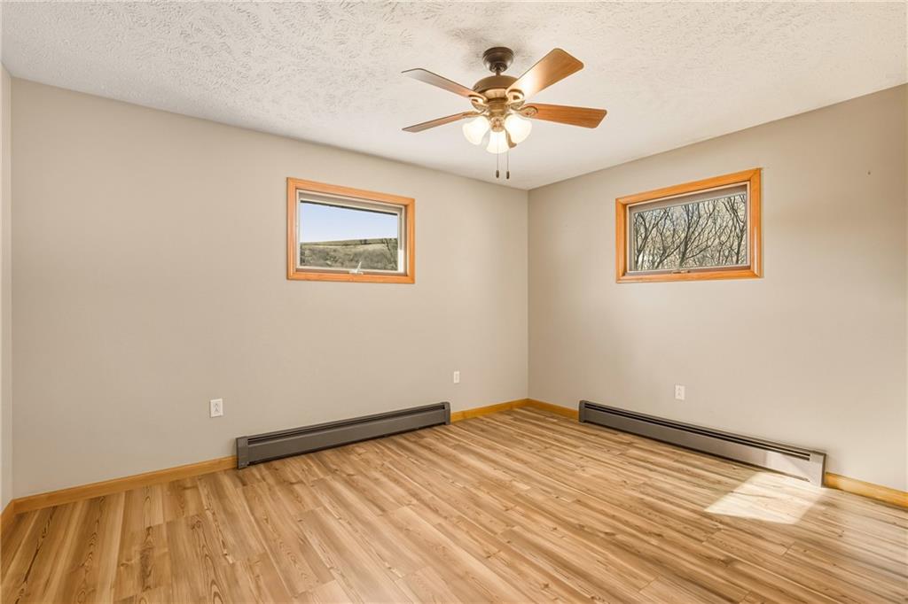 1303 Faidley Road Garrett, PA 15542 - Photo 12 of 43 a view of an empty room with wooden floor and a window