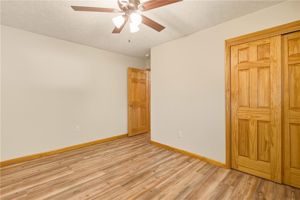 1303 Faidley Road Garrett, PA 15542 - Photo 19 of 43 an empty room with wooden floor closet and windows