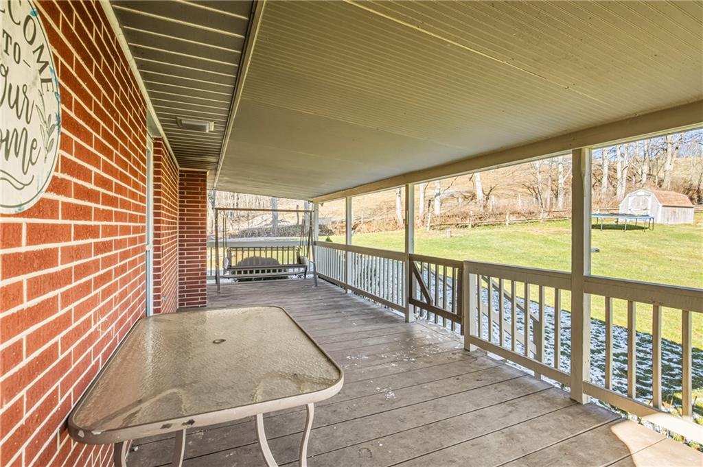 1303 Faidley Road Garrett, PA 15542 - Photo 22 of 43 a view of a porch with wooden floor and outdoor space