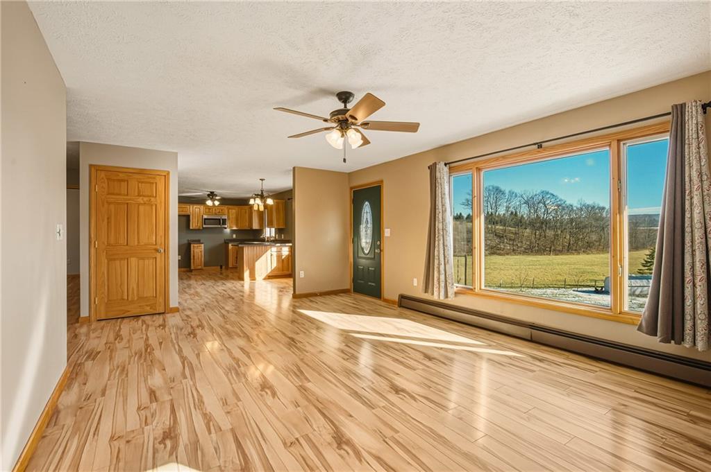 1303 Faidley Road Garrett, PA 15542 - Photo 5 of 43 a view of empty room with wooden floor and fan