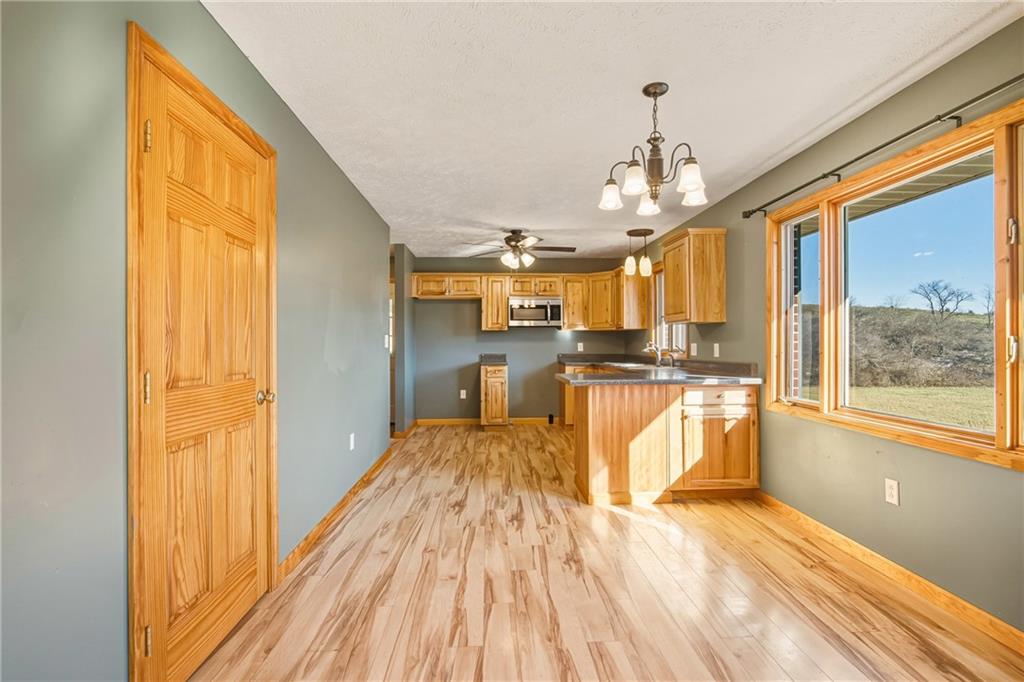 1303 Faidley Road Garrett, PA 15542 - Photo 7 of 43 a view of large kitchen with wooden floor and windows
