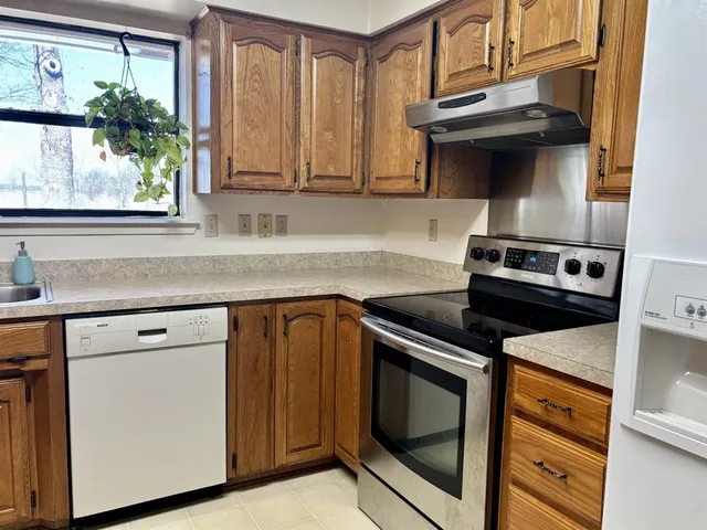 a view of an entryway with a wooden door