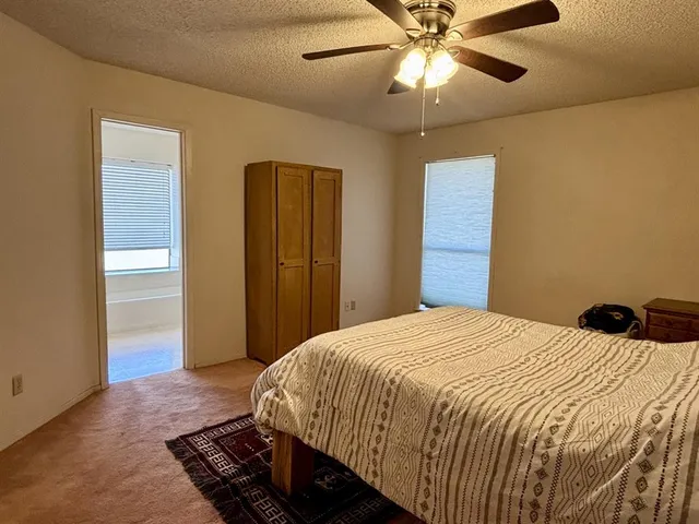 a bathroom with a toilet a sink and a mirror
