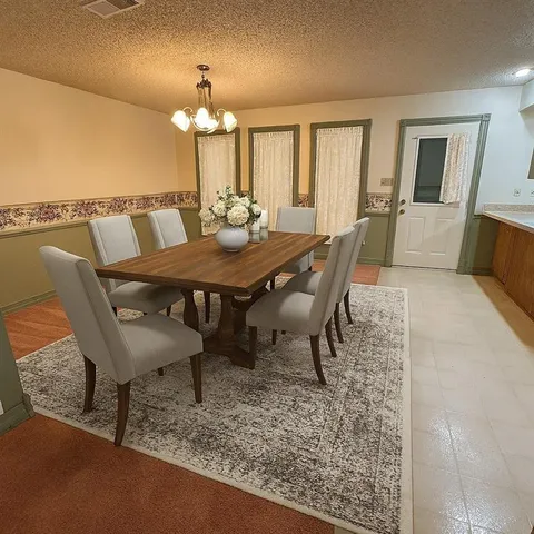 a kitchen with stainless steel appliances granite countertop a stove and a microwave
