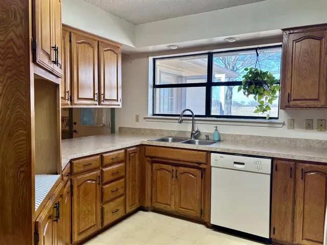 a kitchen with stainless steel appliances and a stove top oven
