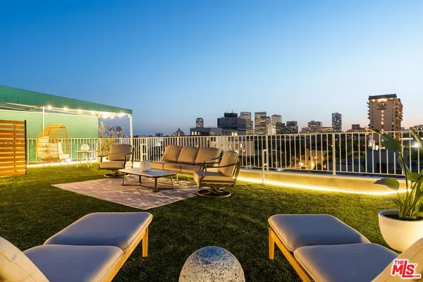 a view of a chairs and table in patio