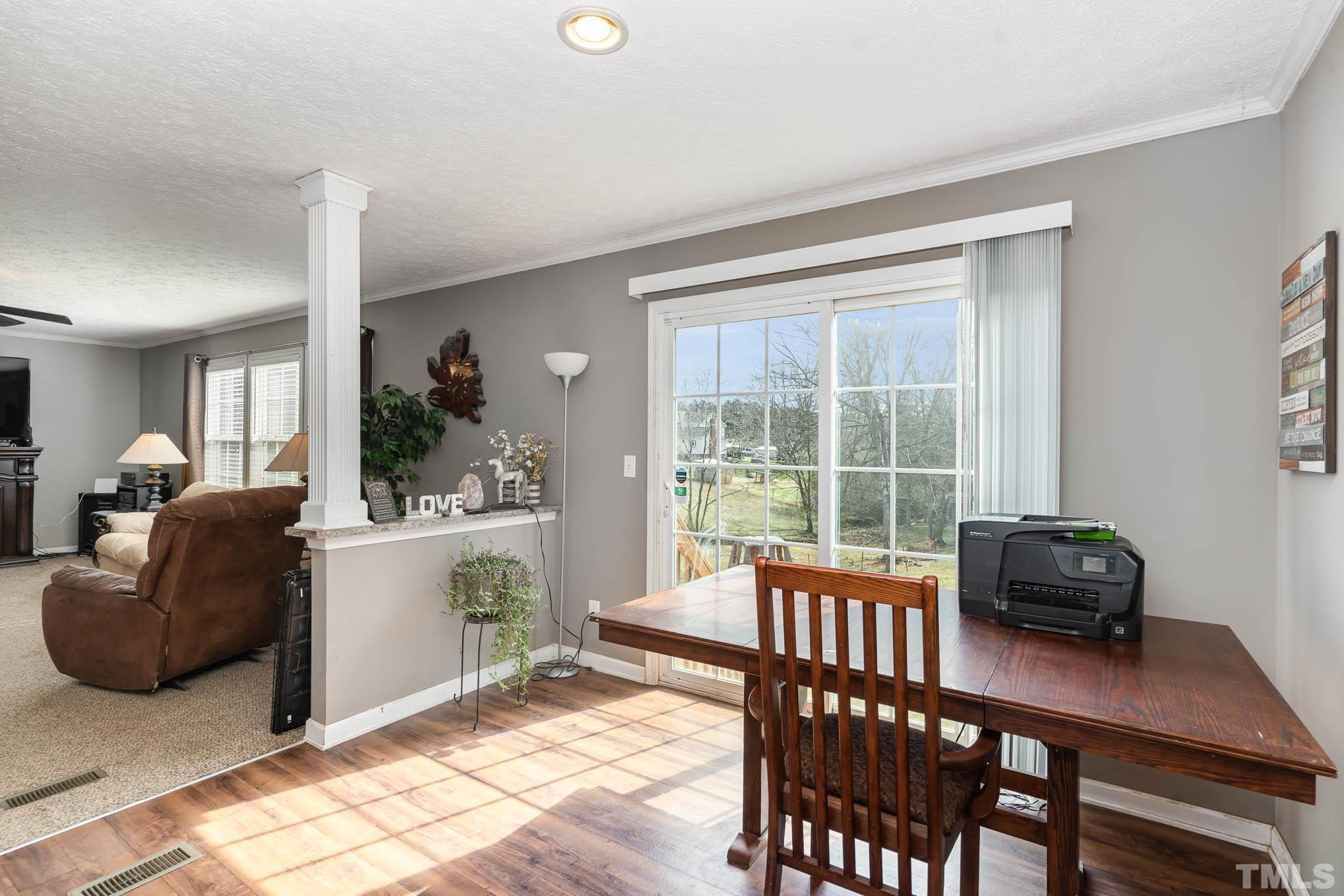 410 Bahama Road Bahama, NC 27503 - Photo 11 of 21 a living room with furniture and a window