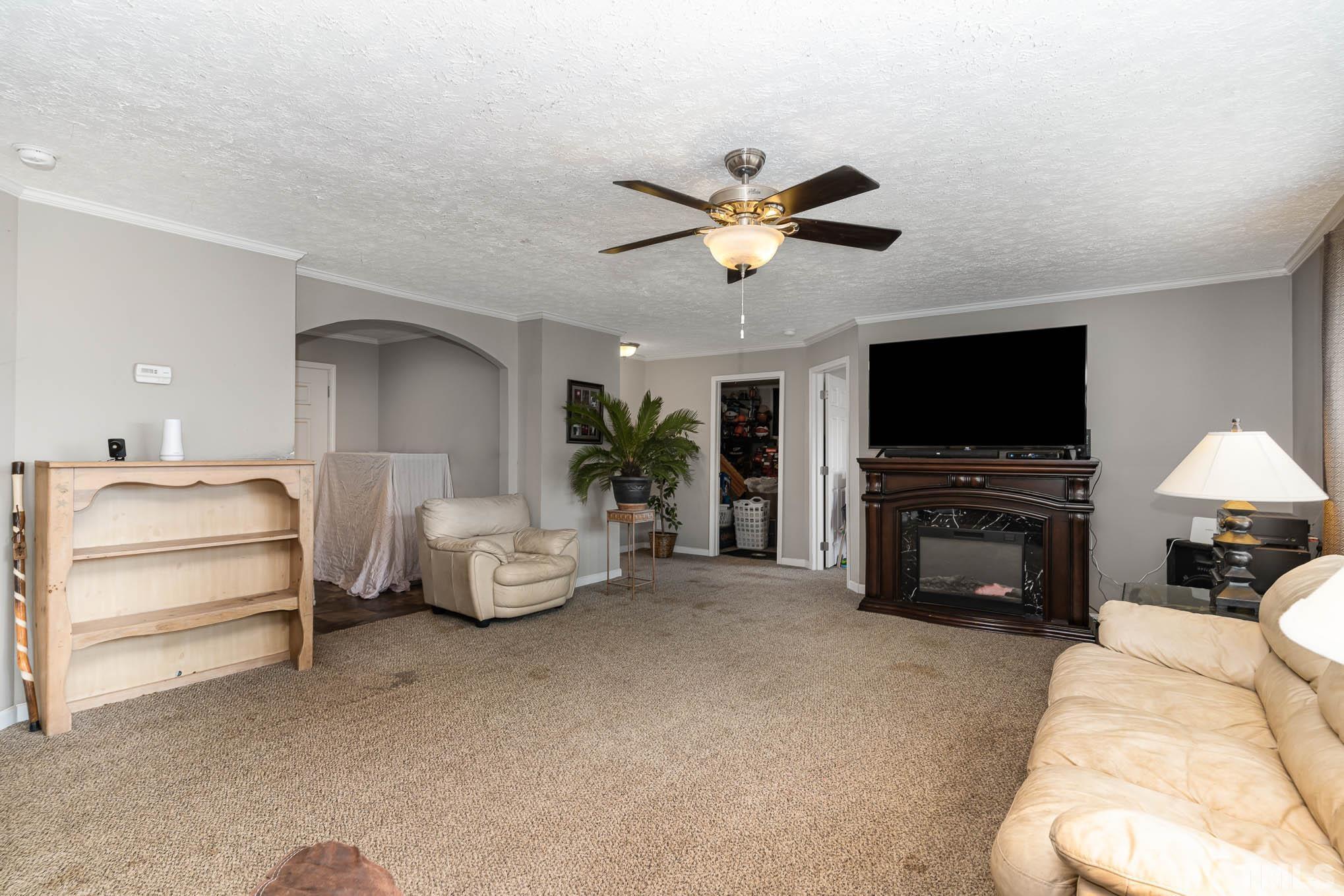 410 Bahama Road Bahama, NC 27503 - Photo 8 of 21 a living room with furniture and a flat screen tv