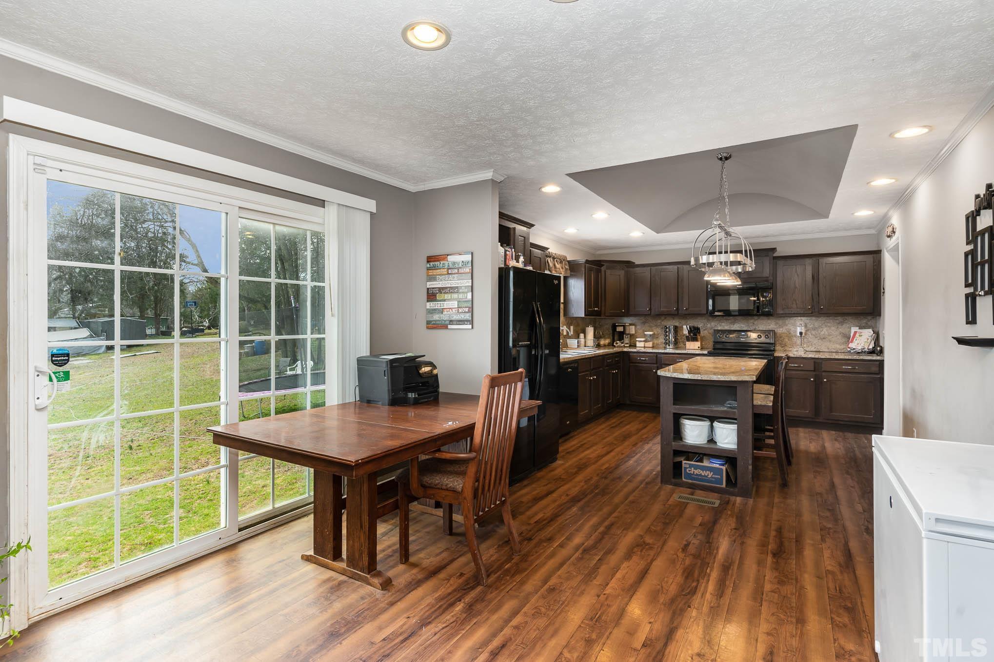 410 Bahama Road Bahama, NC 27503 - Photo 10 of 21 a room with lots of furniture and a large window