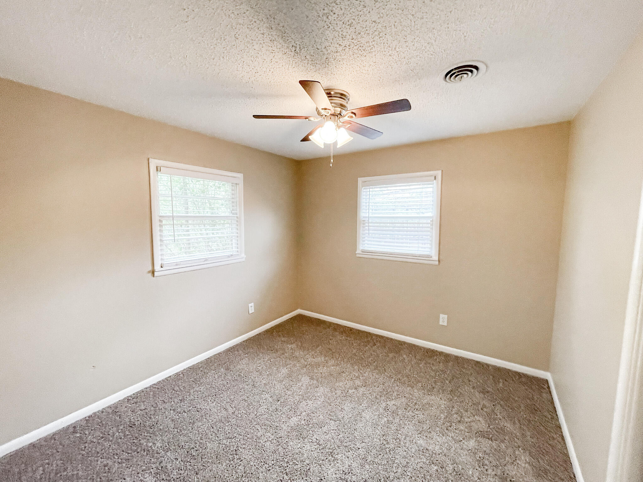 5424 23rd Street Lubbock, TX 79407 - Photo 9 of 11 a view of an empty room with a window