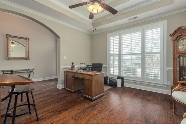 a view of workspace with wooden floor and windows