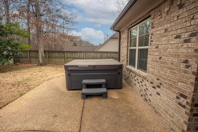 a backyard of a house with sofas