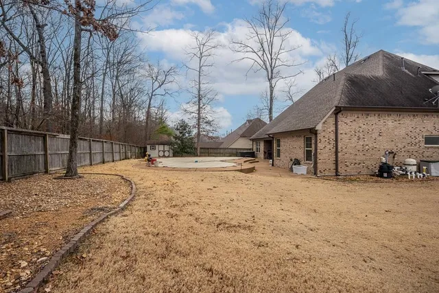 a view of a house with large windows