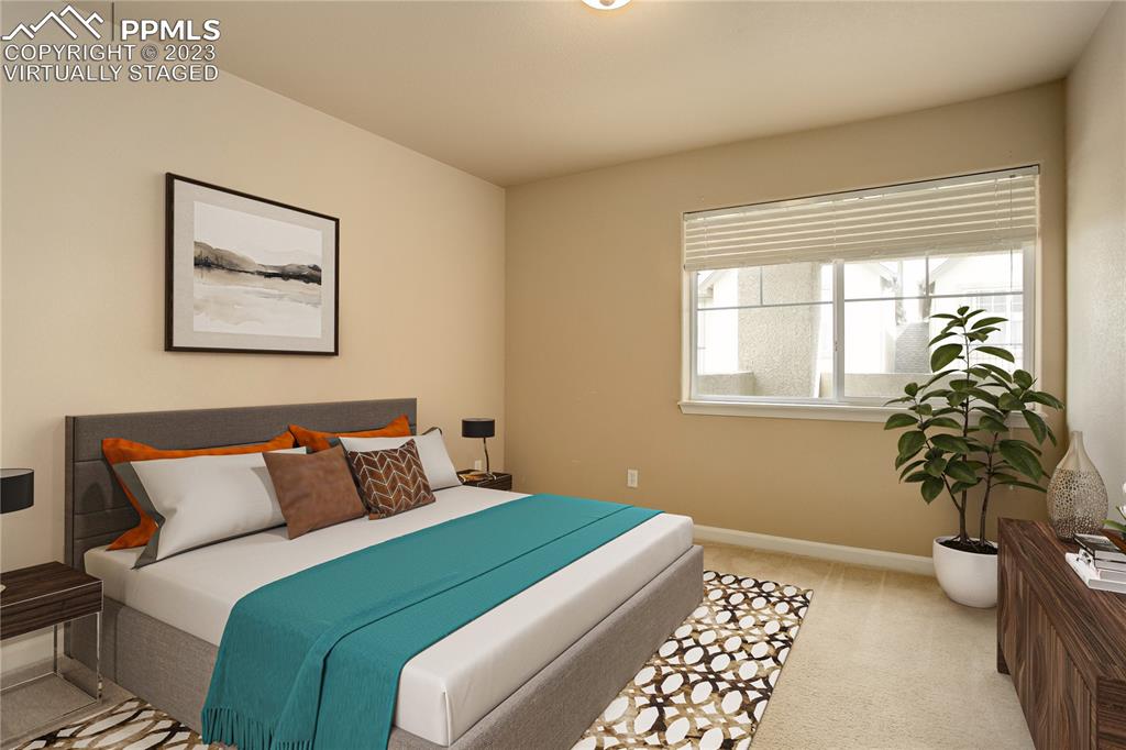7005 Prairie Finch Heights, Unit 203 Colorado Springs, CO 80922 - Photo 14 of 39 a bedroom with a bed and a window