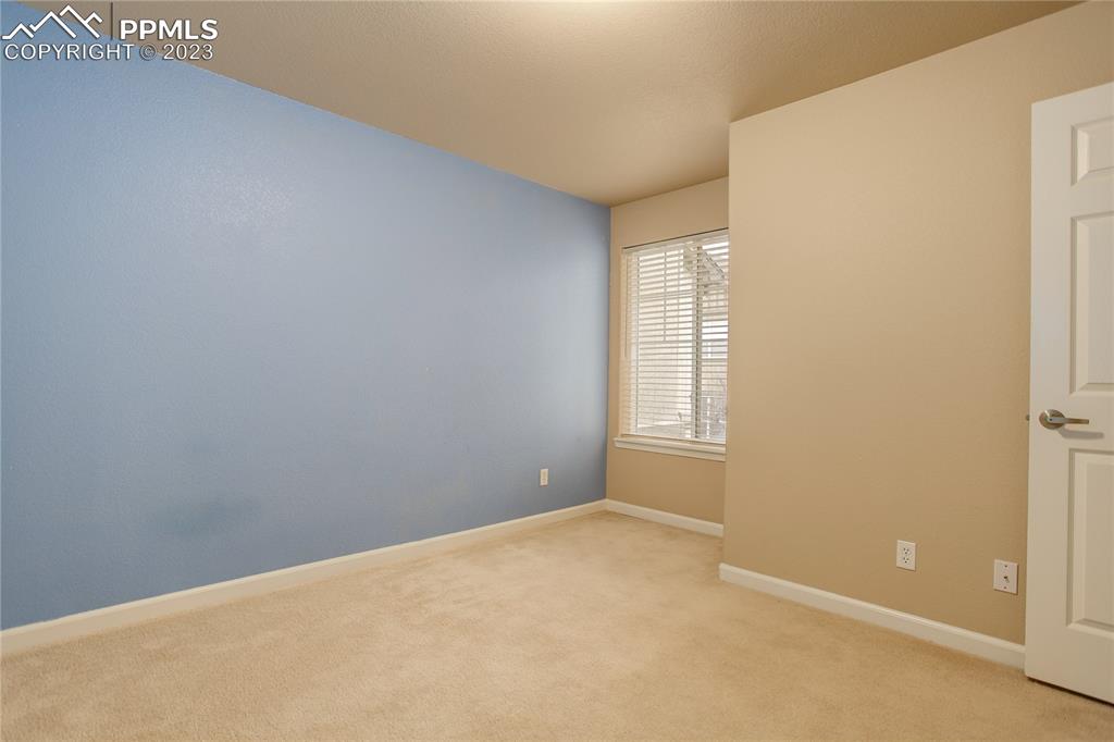 7005 Prairie Finch Heights, Unit 203 Colorado Springs, CO 80922 - Photo 15 of 39 a view of an empty room with a window