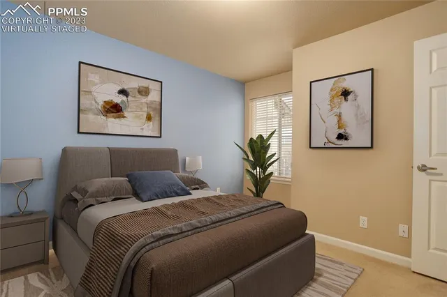 a bedroom with bed and wall painting on the wall