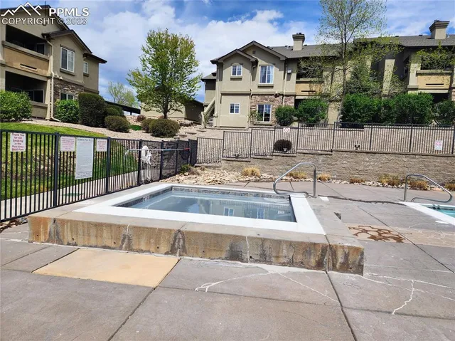 a view of multiple houses with a yard