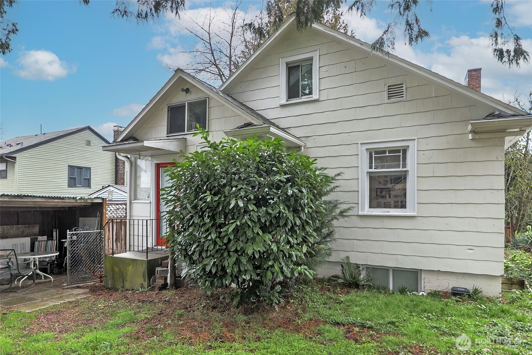 2209 East Roanoke Street Seattle, WA 98112 - Photo 1 of 31 a view of a house with backyard and sitting area