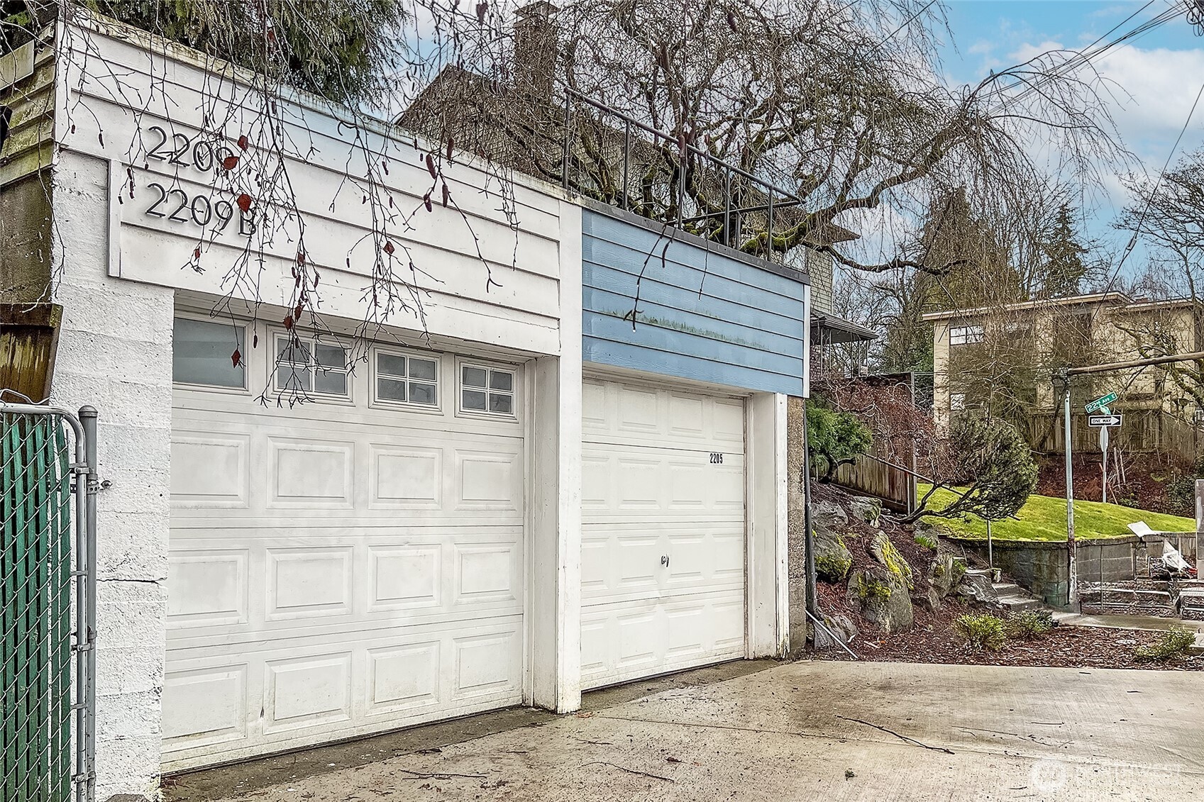 2209 East Roanoke Street Seattle, WA 98112 - Photo 27 of 31 a front view of a house with a yard