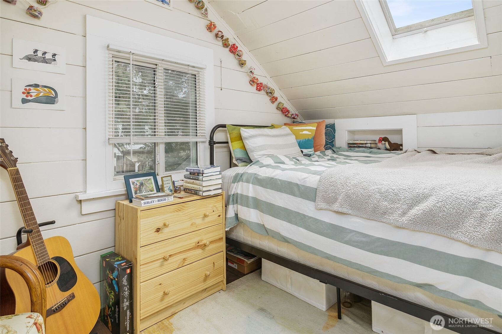 2209 East Roanoke Street Seattle, WA 98112 - Photo 6 of 31 a bedroom with a bed and wooden floor