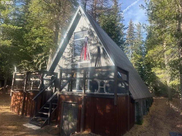 a view of a balcony with wooden floor and stairs