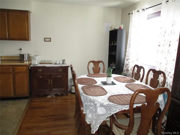 a dining room with table and chairs