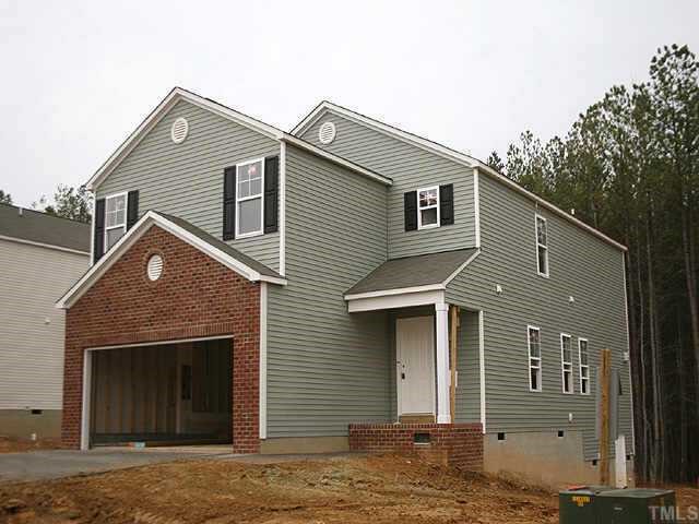 3113 Varcroft Road Knightdale, NC 27545 - Photo 1 of 1 a front view of a house with a garden