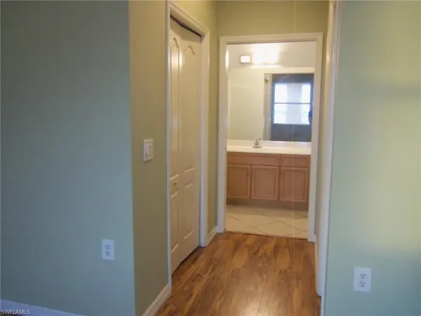 a view of a bathroom from a corridor