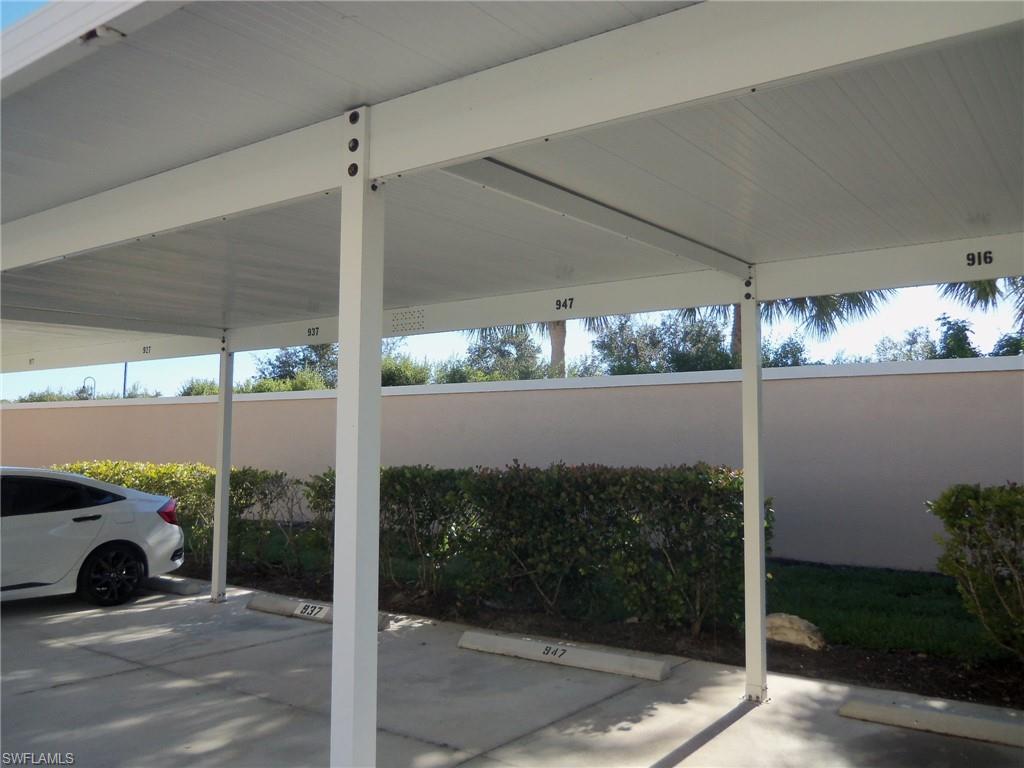 8490 Kingbird Loop, Unit 947 Estero, FL 33967 - Photo 7 of 16 a view of a floor to ceiling window and a fire pit