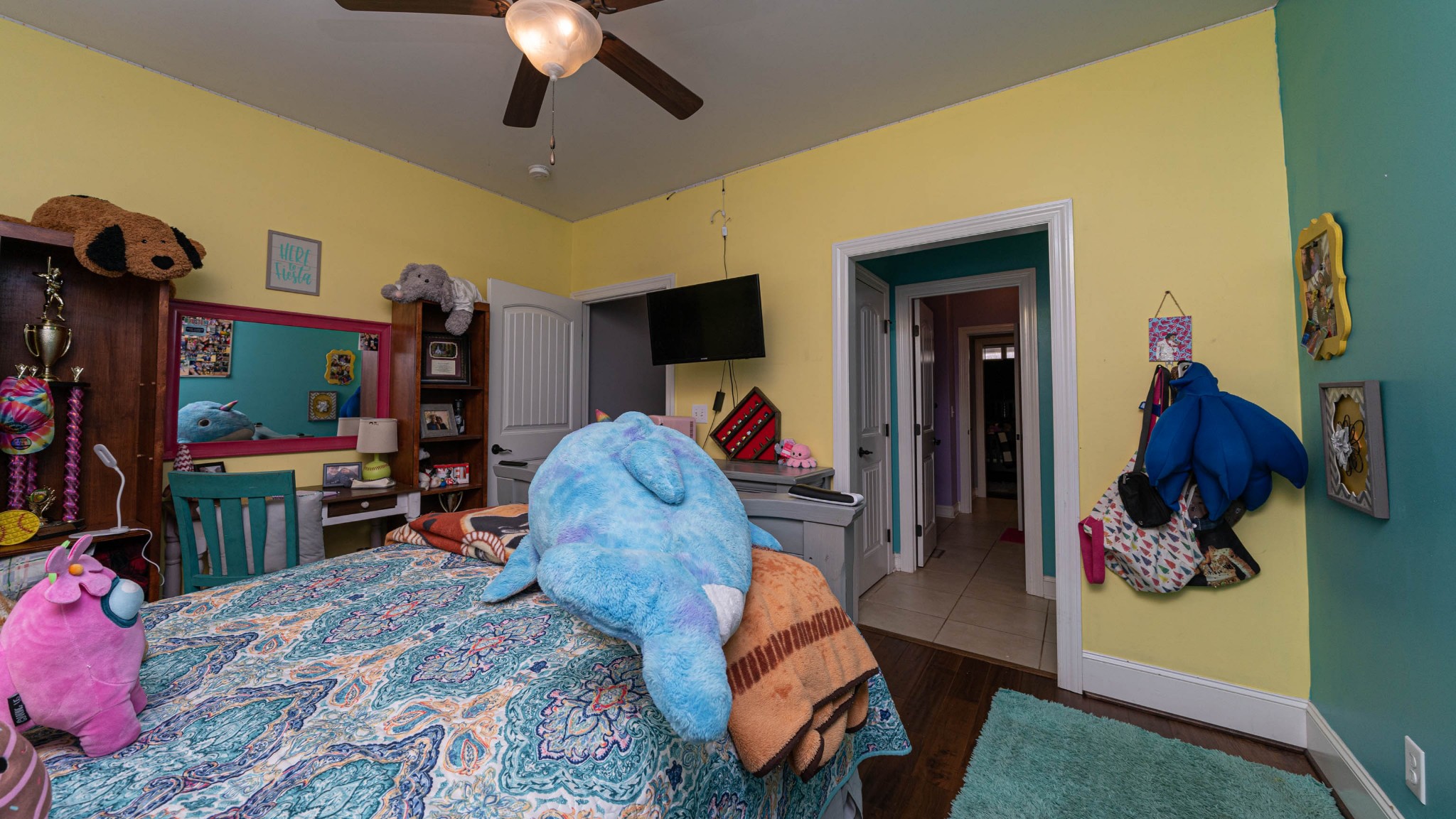 262 West Limestone Road Hazel Green, AL 35750 - Photo 19 of 45 a bed room with a bed and a flat tv screen