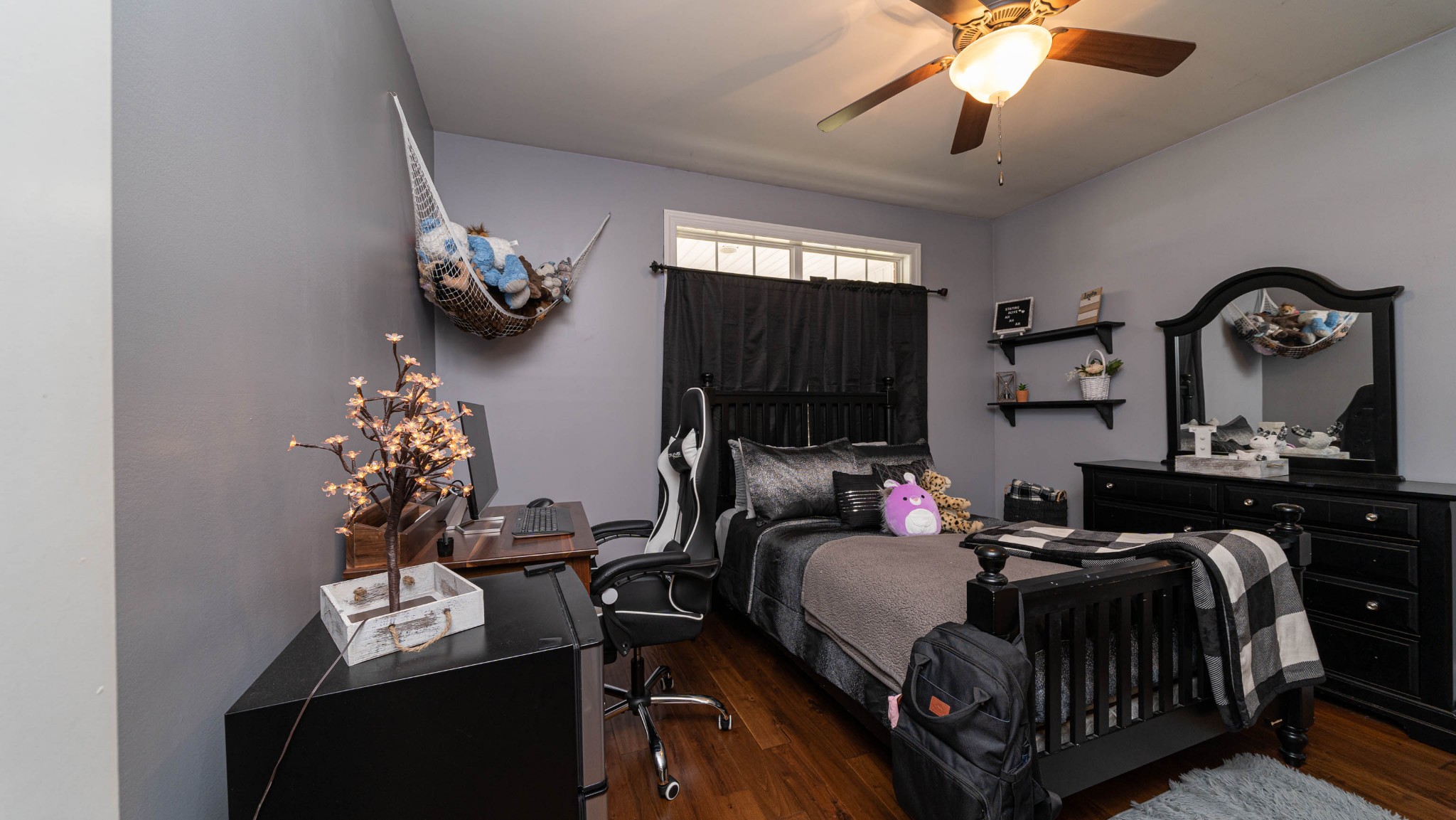 262 West Limestone Road Hazel Green, AL 35750 - Photo 20 of 45 a bedroom with bed and a chandelier