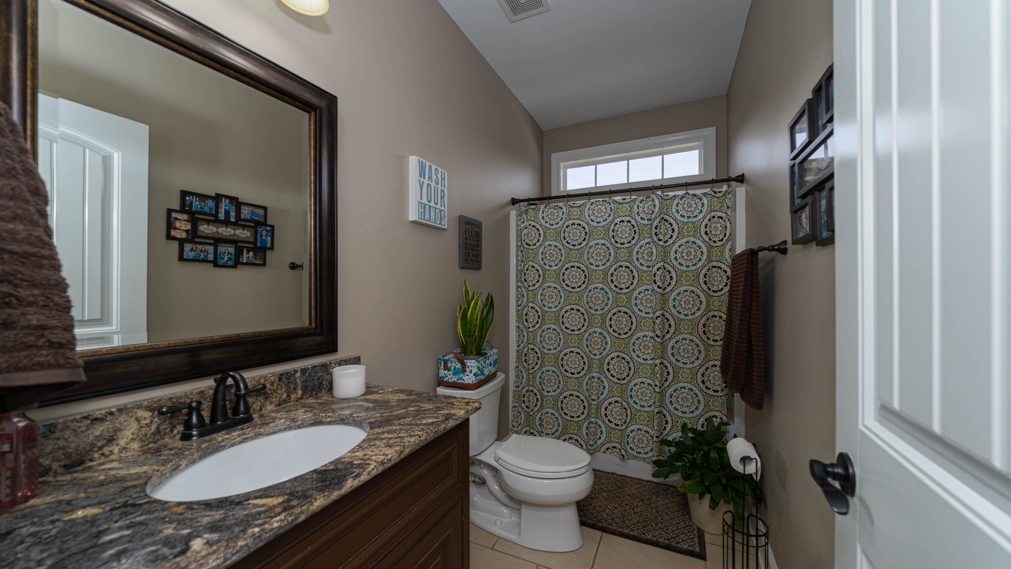 262 West Limestone Road Hazel Green, AL 35750 - Photo 24 of 45 a bathroom with a granite countertop sink toilet and shower