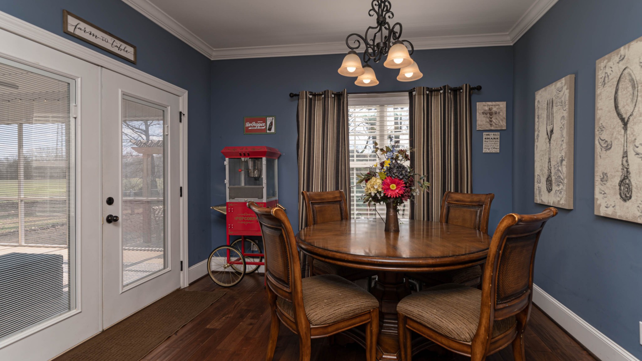 262 West Limestone Road Hazel Green, AL 35750 - Photo 10 of 45 a view of a dining room with furniture wooden floor and chandelier
