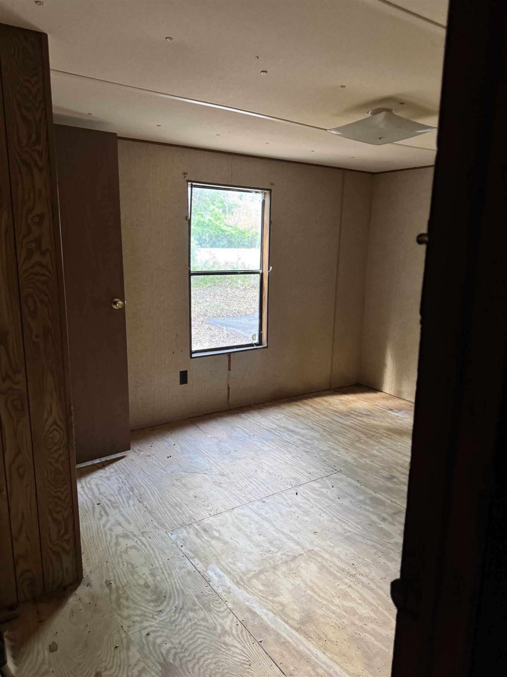 608 Coral Farms Road Florahome, FL 32140 - Photo 13 of 20 a view of an empty room with a window