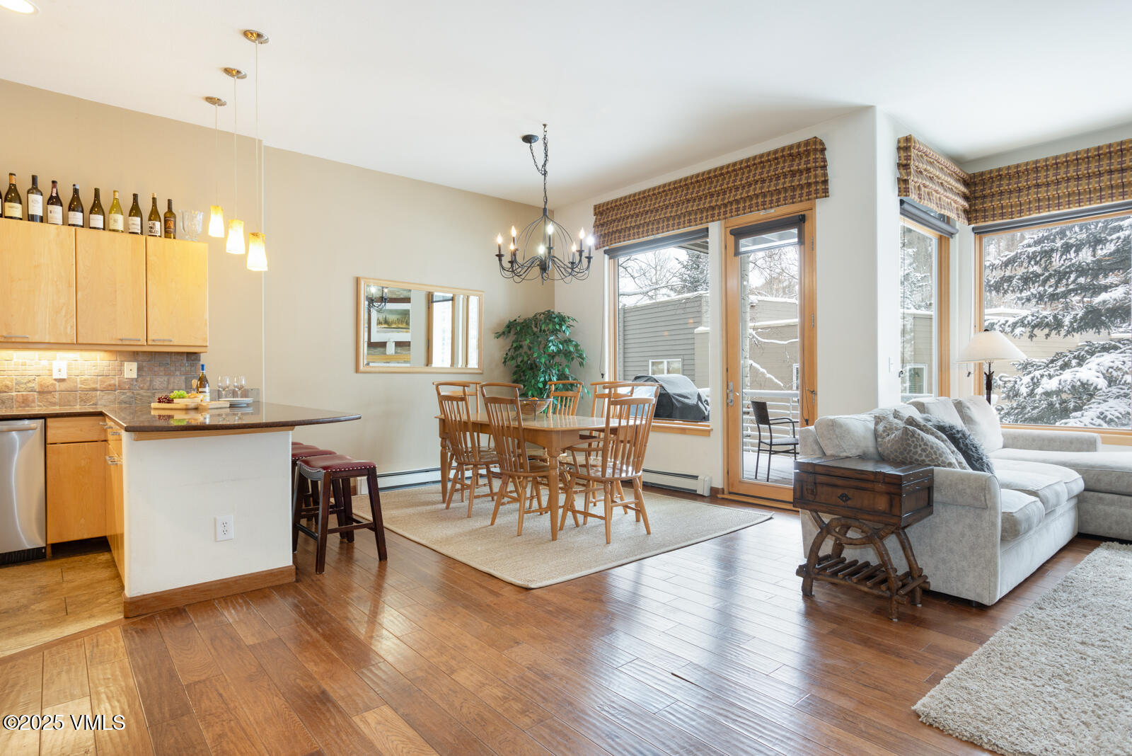 1230 Lions Ridge Loop, Unit 2D Vail, CO 81657 - Photo 15 of 42 a view of a dining room with furniture window and wooden floor