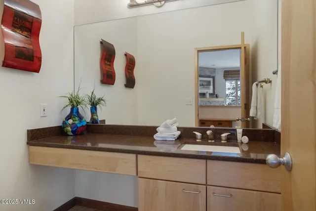 a bedroom with a bed and a lamp with window