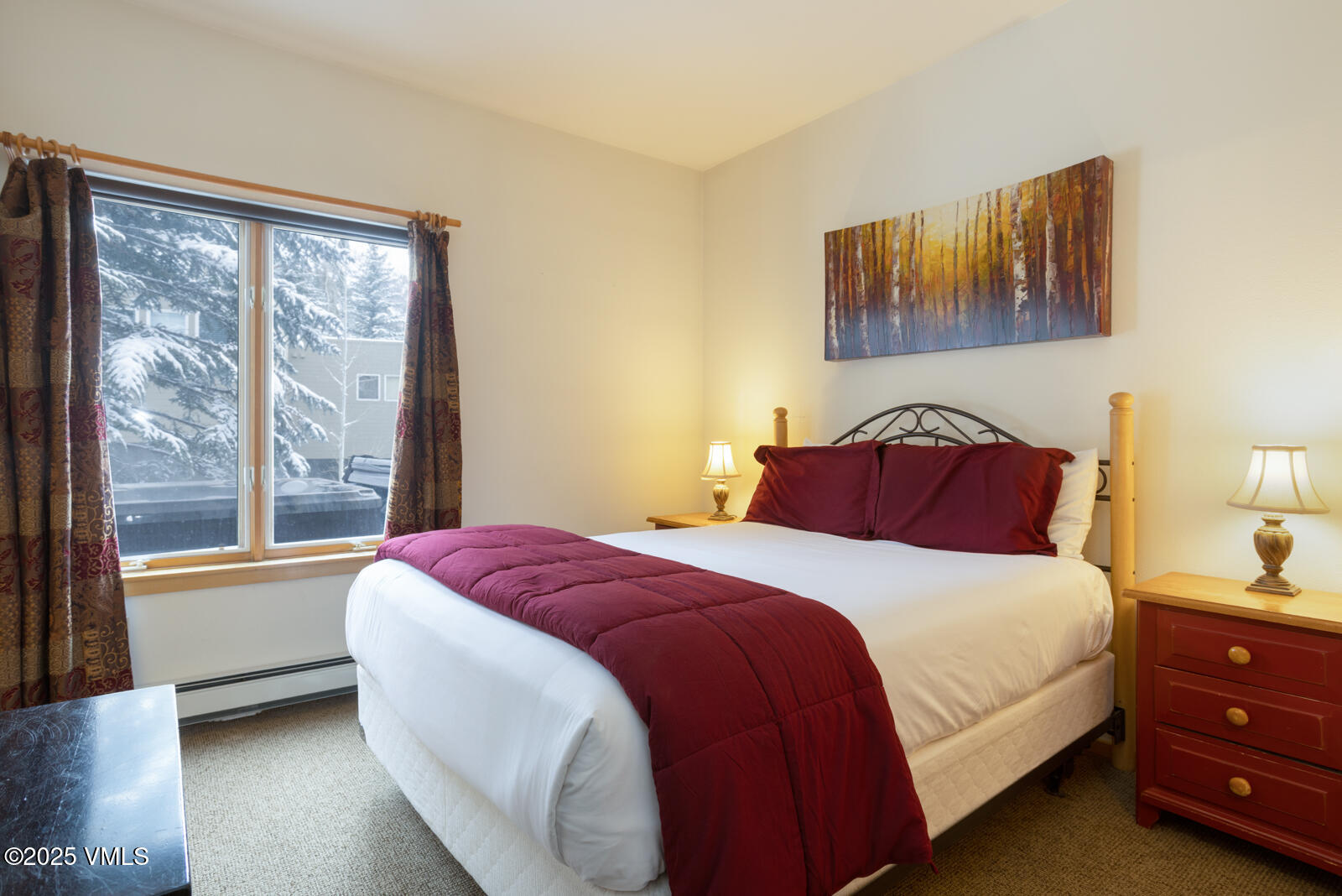 1230 Lions Ridge Loop, Unit 2D Vail, CO 81657 - Photo 28 of 42 a bedroom with a bed and a large window