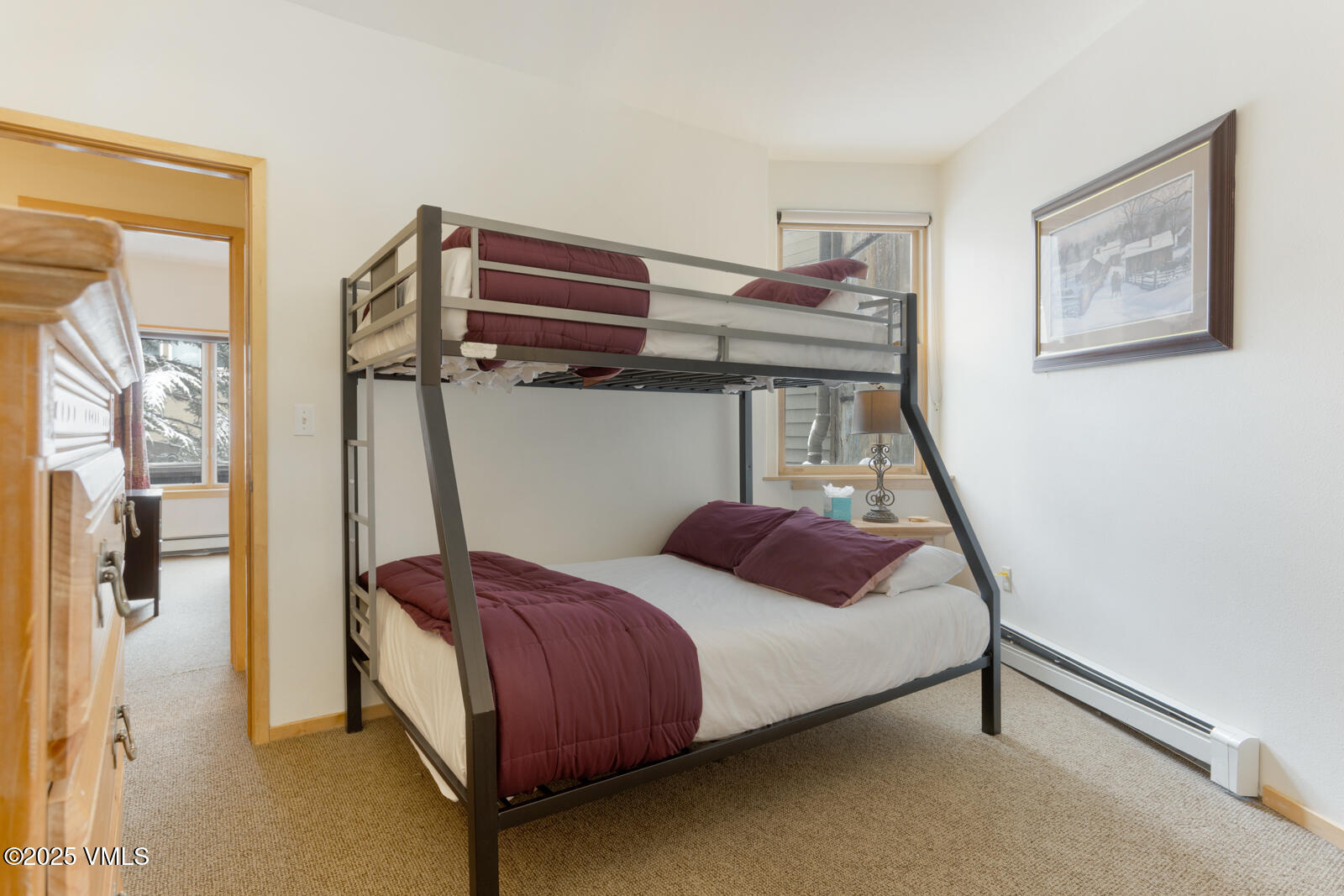 1230 Lions Ridge Loop, Unit 2D Vail, CO 81657 - Photo 31 of 42 a bedroom with a bed and a window