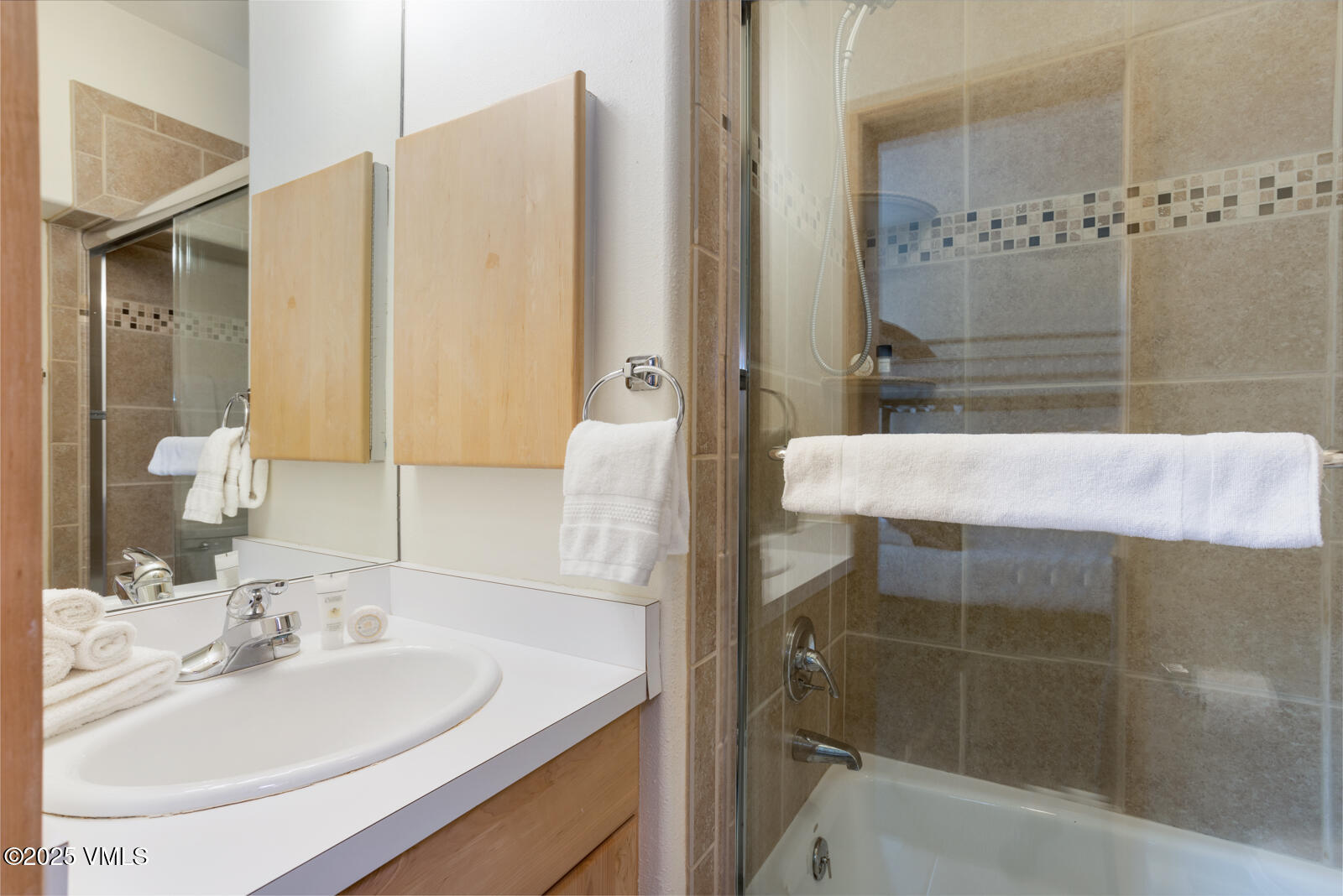 1230 Lions Ridge Loop, Unit 2D Vail, CO 81657 - Photo 33 of 42 a bathroom with a sink and a mirror