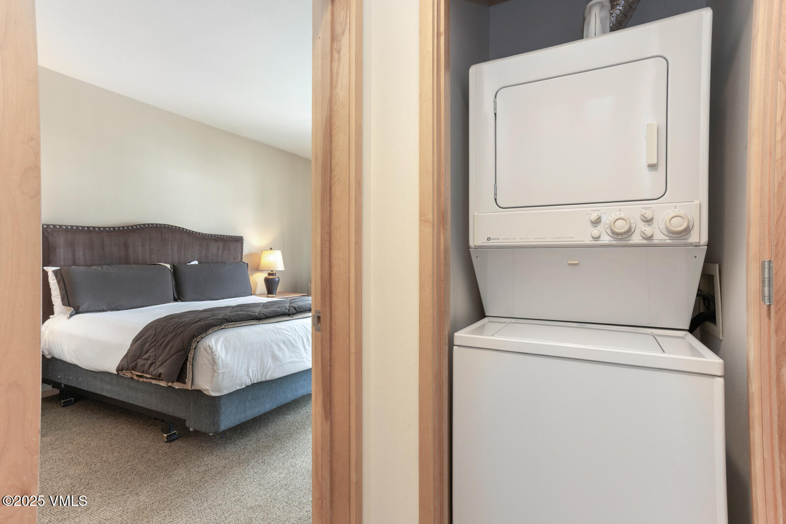 1230 Lions Ridge Loop, Unit 2D Vail, CO 81657 - Photo 34 of 42 a bedroom with a bed and mirror