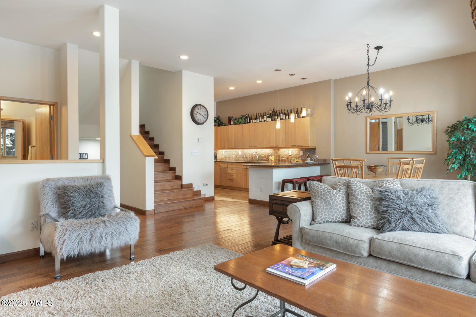 1230 Lions Ridge Loop, Unit 2D Vail, CO 81657 - Photo 5 of 42 a living room with furniture and a chandelier