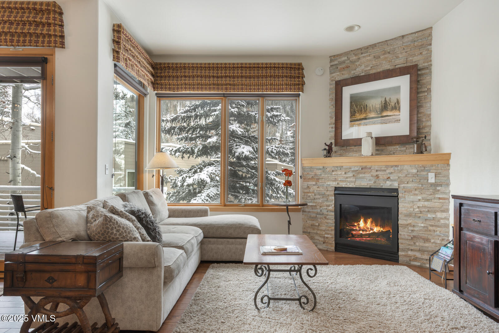 1230 Lions Ridge Loop, Unit 2D Vail, CO 81657 - Photo 6 of 42 a living room with furniture and a fireplace