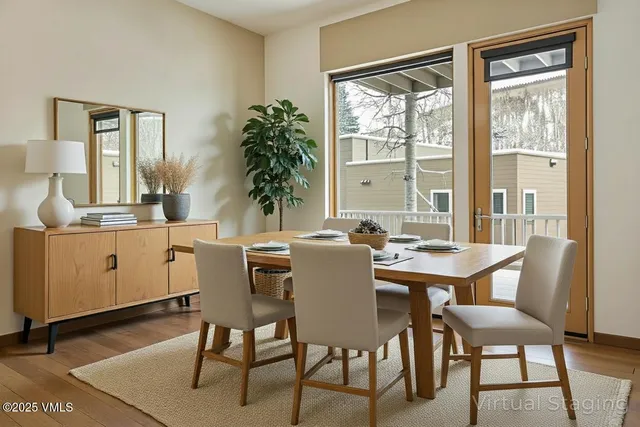 a view of a dining room with furniture window and wooden floor