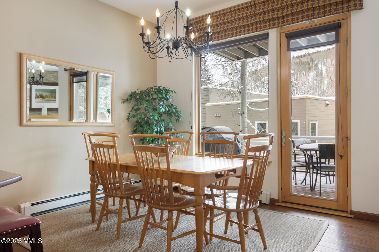 1230 Lions Ridge Loop, Unit 2D Vail, CO 81657 - Photo 8 of 42 a view of a dining room with furniture window and wooden floor