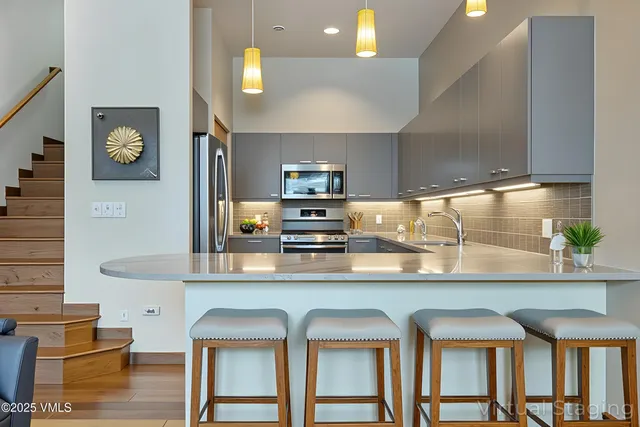 a view of backyard with wooden fence