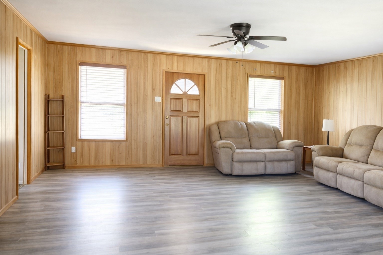 a living room with furniture and a window